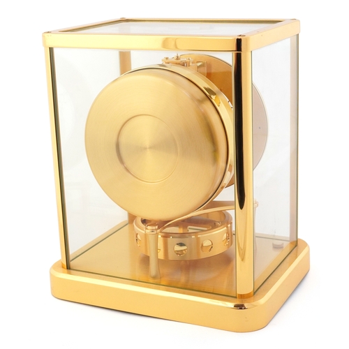 23 - Jaeger LeCoultre brass cased Atmos clock numbered 702280, 22.5cm high.
