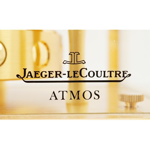 23 - Jaeger LeCoultre brass cased Atmos clock numbered 702280, 22.5cm high.