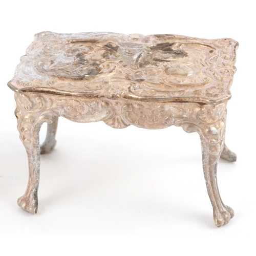 547 - A Chick & Sons Ltd., set of Elizabeth II silver doll's house furniture comprising a table, sofa and ... 