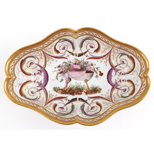 14 - 18th century French porcelain scalloped dish hand painted with a basket of flowers raised on an ostr... 
