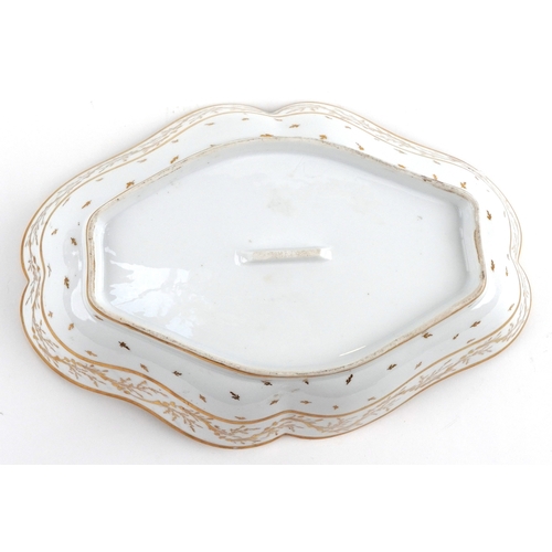 14 - 18th century French porcelain scalloped dish hand painted with a basket of flowers raised on an ostr... 