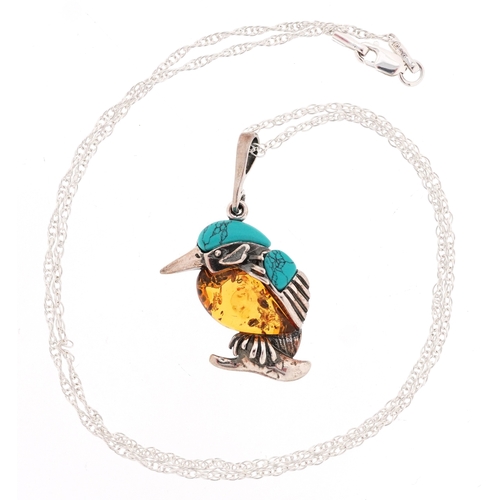 Silver, turquoise and natural amber pendant in the form of a Kingfisher, on a silver necklace, 3.7cm high and 44cm in length, total 5.7g.