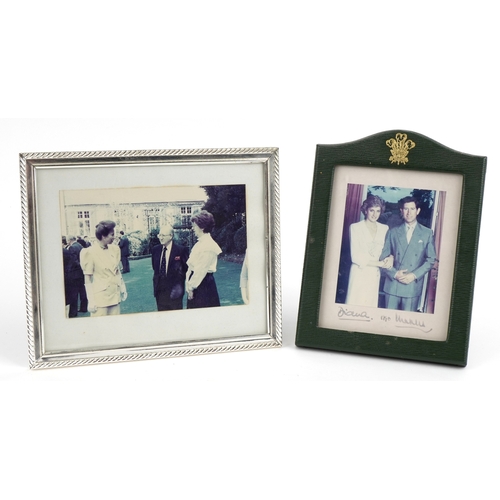 Royalty interest photograph of Princess Diana and Charles bearing ink inscription Diana.1990 Charles, housed in a green leather easel frame together with a photograph of Princess Anne.