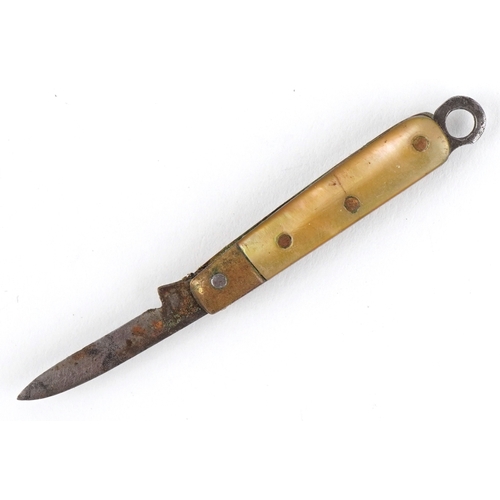50 - Miniature mother of pearl flanked folding pocket knife, 2.9cm in length closed.
