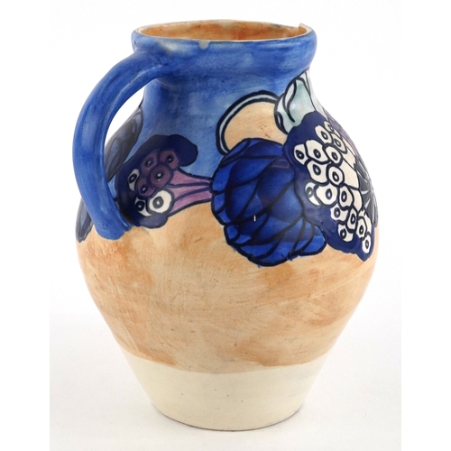 11 - Charlotte Rhead for Bursley Ware, Art Deco pottery jug hand painted with flowers, 21cm high.