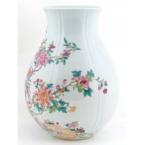  Large Chinese porcelain vase finely hand painted in the famille verte palette with birds of paradise... 