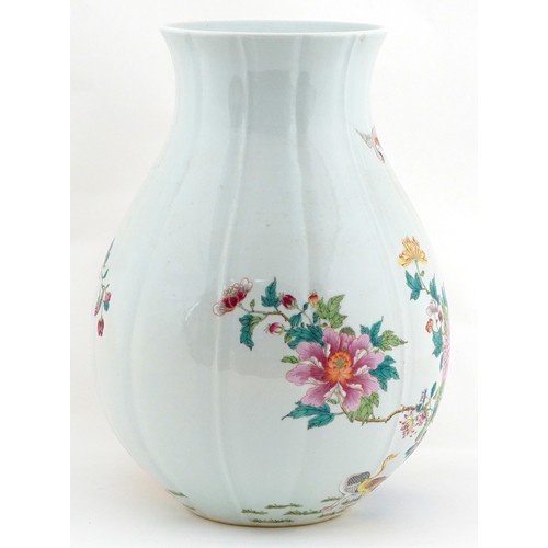  Large Chinese porcelain vase finely hand painted in the famille verte palette with birds of paradise... 