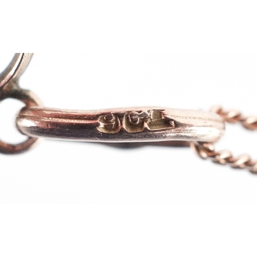 3050 - Edwardian 9ct gold purple stone openwork pendant on a gold necklace, the clasp marked 14ct gold, 4cm... 