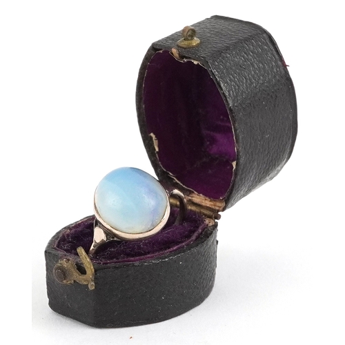 3021 - Antique unmarked gold cabochon moonstone ring, size P, 3.1g, housed in a ring box.