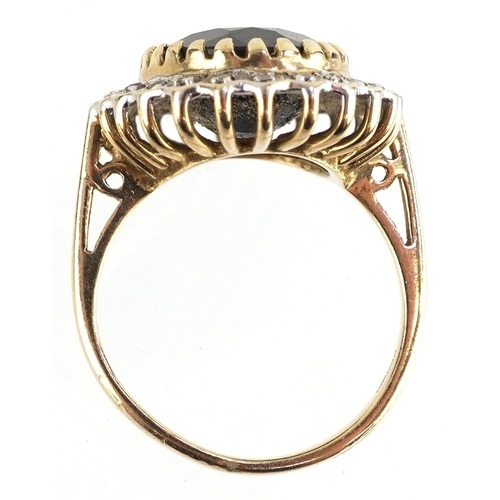 3043 - 9ct gold sapphire and diamond cluster ring, total diamond weight approximately 0.12 carat, the sapph... 