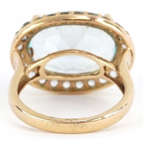 3035 - 9ct gold topaz and blue stone ring, the topaz approximately 10.30 carat, size L, 5.3g.