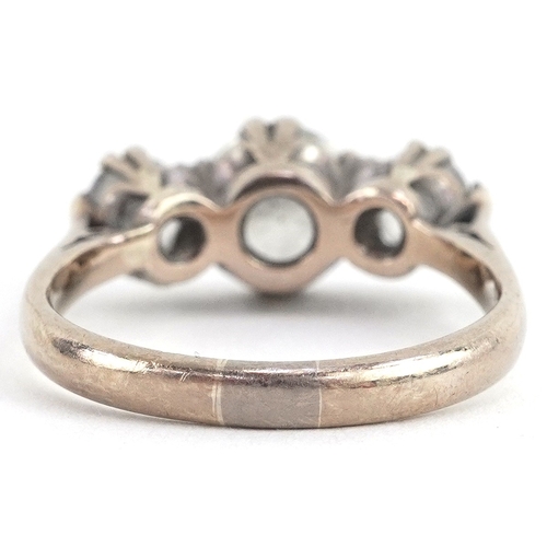  18ct white gold diamond trilogy ring, the central diamond approximately 1.09 carat, size M, 4.7g.