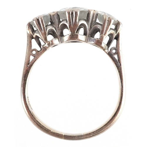 18ct white gold diamond trilogy ring, the central diamond approximately 1.09 carat, size M, 4.7g.