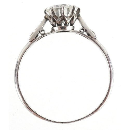 3007 - Platinum diamond solitaire ring with diamond set shoulders, the central diamond approximately 1.01 c... 