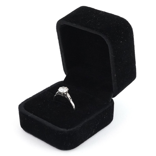 3007 - Platinum diamond solitaire ring with diamond set shoulders, the central diamond approximately 1.01 c... 