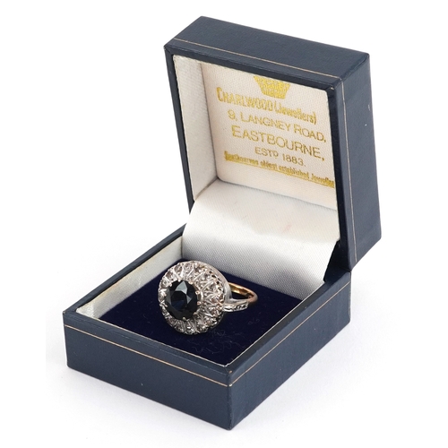  18ct yellow and white gold sapphire and diamond cluster ring, the sapphire approximately 3.16 carat,... 