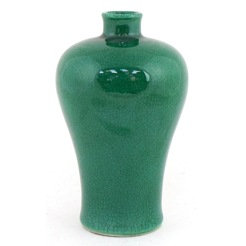 41 - Chinese porcelain baluster vase having a green crackle glaze, 15cm high.