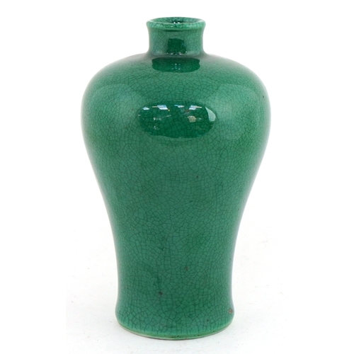 41 - Chinese porcelain baluster vase having a green crackle glaze, 15cm high.