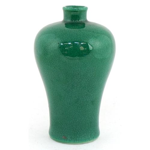 41 - Chinese porcelain baluster vase having a green crackle glaze, 15cm high.