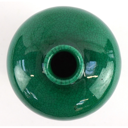 41 - Chinese porcelain baluster vase having a green crackle glaze, 15cm high.