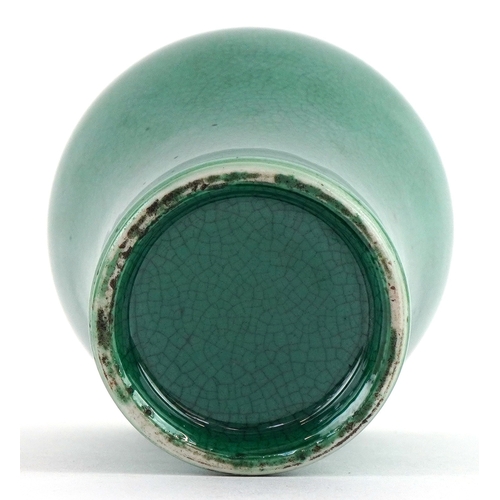 41 - Chinese porcelain baluster vase having a green crackle glaze, 15cm high.