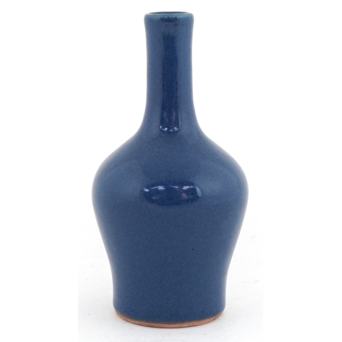46 - Chinese stoneware bottleneck vase having a powder blue glaze, 14cm high.