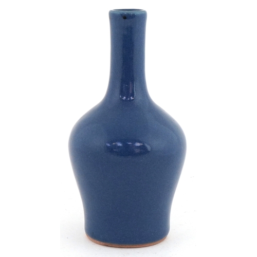 46 - Chinese stoneware bottleneck vase having a powder blue glaze, 14cm high.