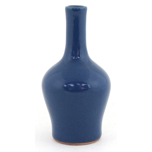 46 - Chinese stoneware bottleneck vase having a powder blue glaze, 14cm high.