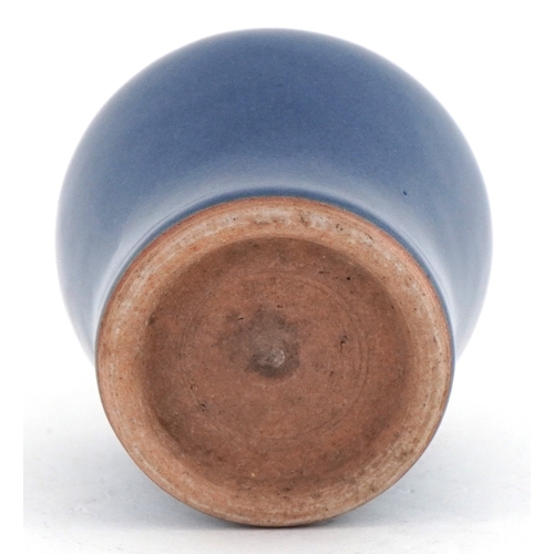 46 - Chinese stoneware bottleneck vase having a powder blue glaze, 14cm high.