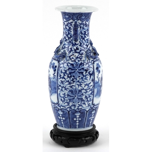 83 - Chinese blue and white porcelain baluster vase having twin chilong handles, hand painted with panels... 