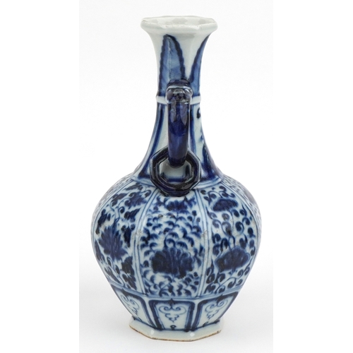 38 - Chinese porcelain blue and white twin handled vase hand painted with flowers and foliage, 27cm high.