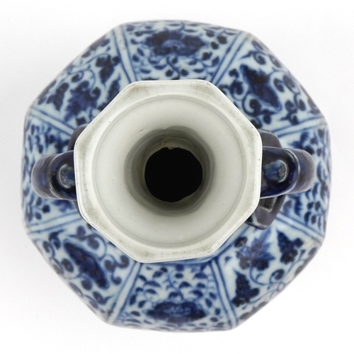 38 - Chinese porcelain blue and white twin handled vase hand painted with flowers and foliage, 27cm high.