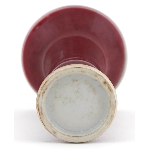 49 - Chinese porcelain bud vase having a sang de boeuf glaze, 12cm high.