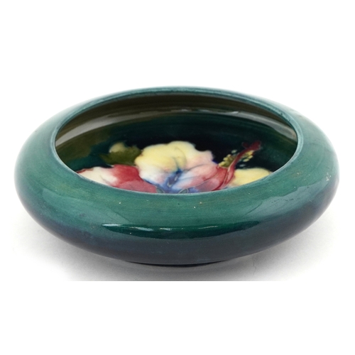 57 - Walter Moorcroft Hibiscus pattern pottery dish, 11cm high.