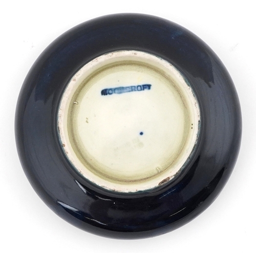 57 - Walter Moorcroft Hibiscus pattern pottery dish, 11cm high.