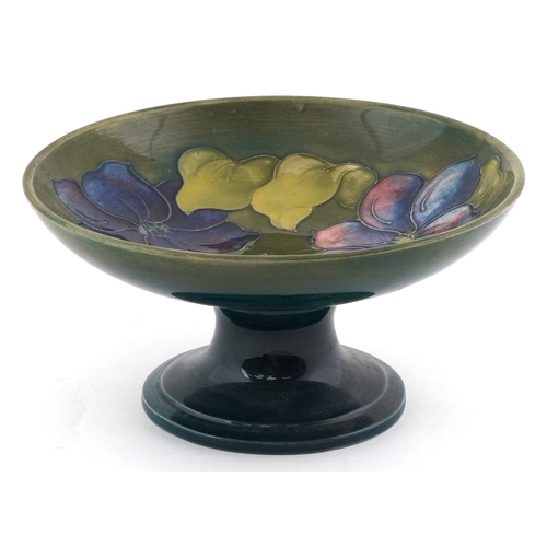 56 - Walter Moorcroft Clematis pattern pottery pedestal dish, 9cm high x 18cm in diameter.
