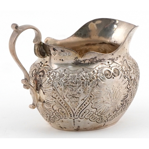 485 - Martin, Hall & Co., Victorian silver milk jug embossed with flowers and foliage, Sheffield 1894, 11.... 