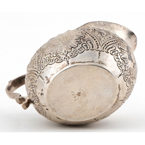 485 - Martin, Hall & Co., Victorian silver milk jug embossed with flowers and foliage, Sheffield 1894, 11.... 