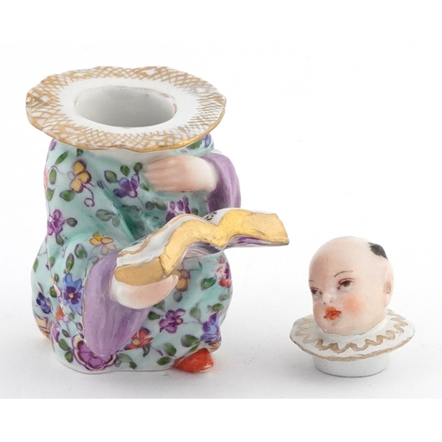 20 - 19th century Meissen style German porcelain inkwell modelled as a Chinese child with book, 9cm high.