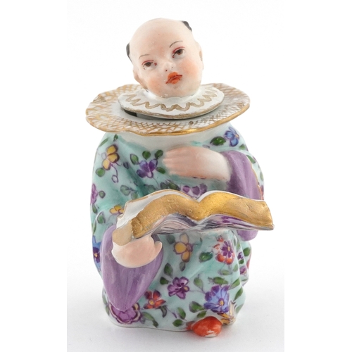 20 - 19th century Meissen style German porcelain inkwell modelled as a Chinese child with book, 9cm high.