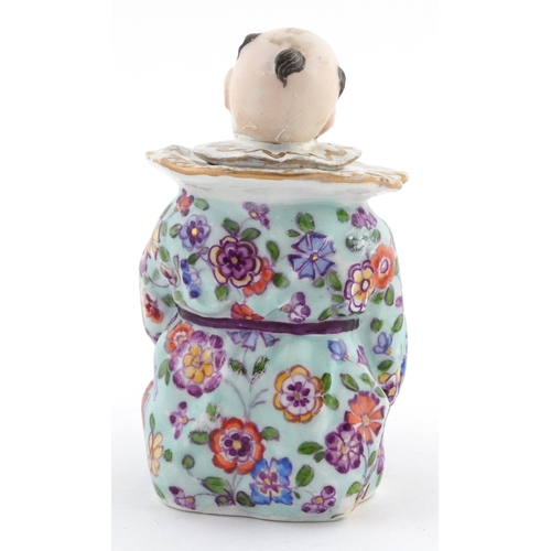 20 - 19th century Meissen style German porcelain inkwell modelled as a Chinese child with book, 9cm high.