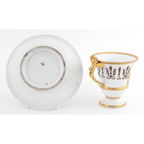15 - 19th century French porcelain teacup and saucer having a figural handle, decorated with Neo-Classica... 
