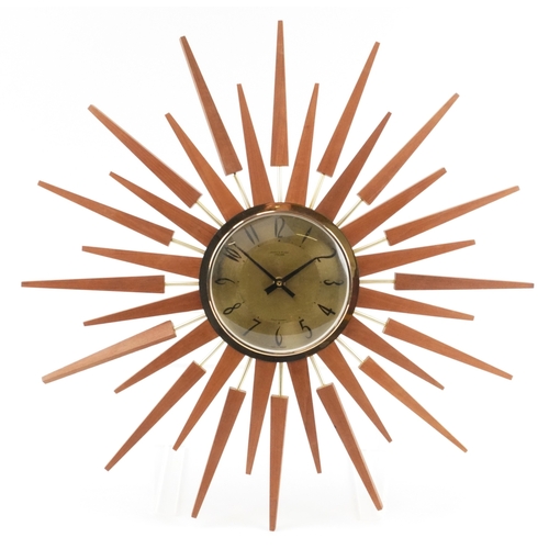 76 - Anstey & Wilson, mid century teak sunburst wall clock, 62cm in diameter.