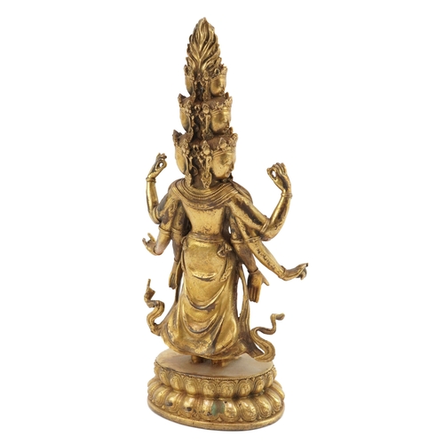 51 - Chino Tibetan patinated bronze figure of a Buddha set with purple, green and blue coloured stones, 2... 