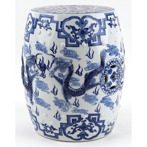 94 - Chinese export blue and white porcelain barrel garden seat hand painted and relief decorated with dr... 