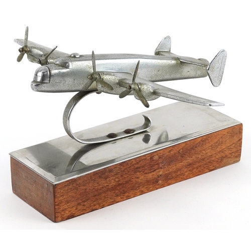 Vintage chromed model of a Handley Page Halifax raised on a wooden plinth base, 28cm wide.