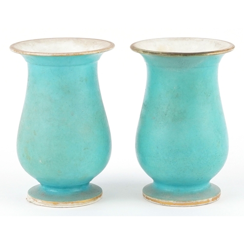 21 - A pair of late 19th century Sèvres style porcelain diminutive spill vases with hand painted floral c... 