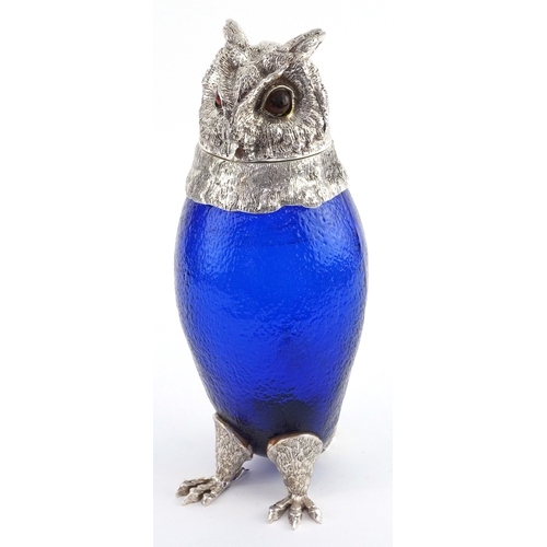 1028 - Novelty blue glass and silver plated claret jug in the form of an owl, 29cm high.