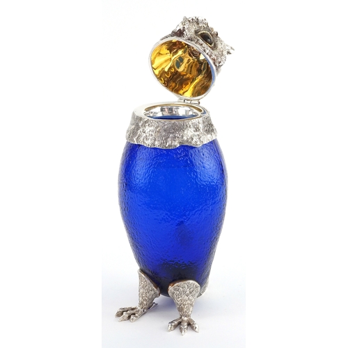 1028 - Novelty blue glass and silver plated claret jug in the form of an owl, 29cm high.