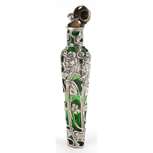 497 - Large silver overlaid green glass scent bottle pierced and embossed with stylized flowers, SJ maker'... 